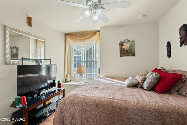 bedroom featuring hardwood / wood-style floors and ceiling fan