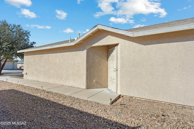 property entrance featuring a patio area