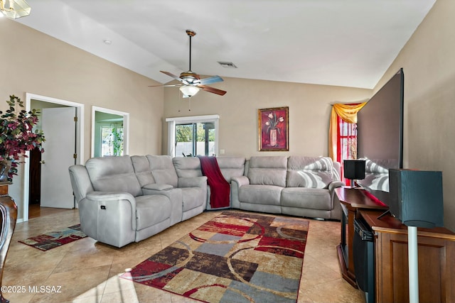 tiled living room with ceiling fan and lofted ceiling