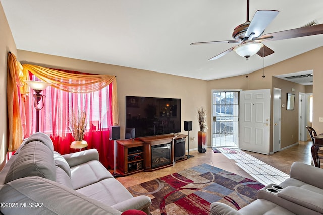 tiled living room featuring vaulted ceiling and ceiling fan