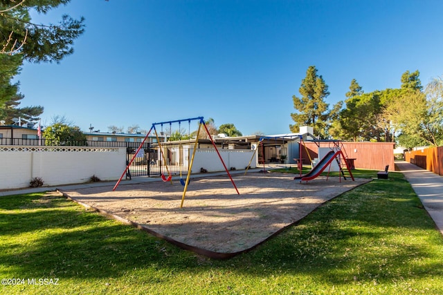 view of playground with a yard