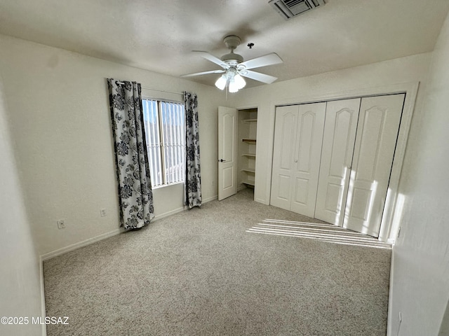 unfurnished bedroom with ceiling fan and light carpet