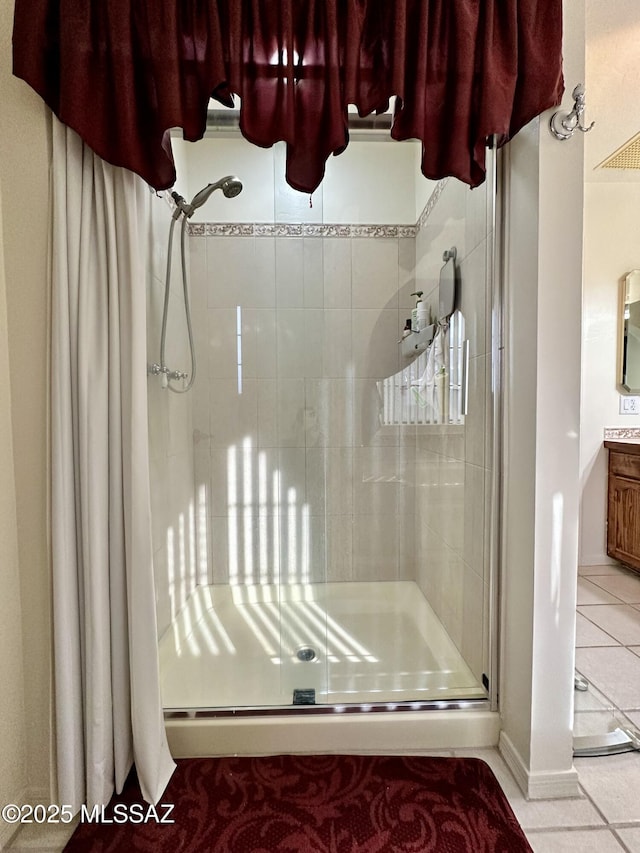 bathroom featuring tile patterned flooring and a shower with shower door