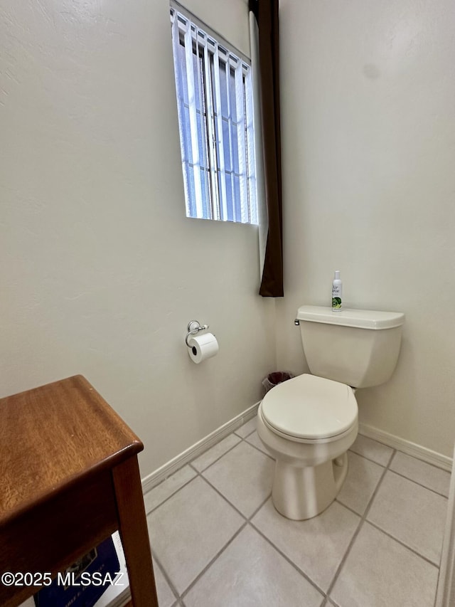 bathroom featuring tile patterned floors and toilet