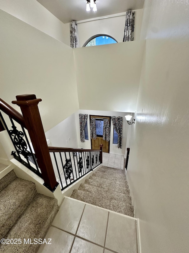 stairs with tile patterned flooring