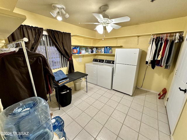 laundry area featuring ceiling fan, light tile patterned floors, and independent washer and dryer