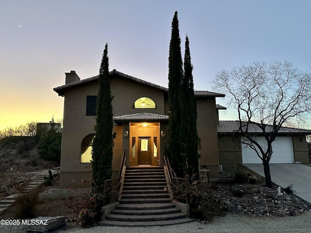 view of front of home with a garage