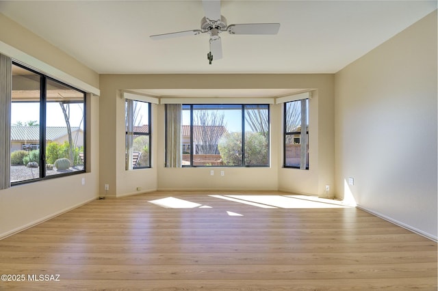 unfurnished room with light hardwood / wood-style floors and ceiling fan