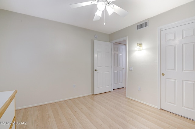 unfurnished bedroom featuring ceiling fan and light wood-type flooring