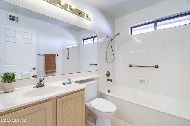 full bathroom featuring plenty of natural light, toilet, bathing tub / shower combination, and vanity