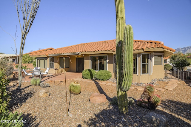 view of front of property featuring a patio