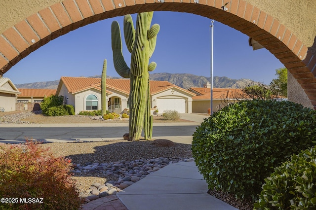 exterior space featuring a garage and a mountain view