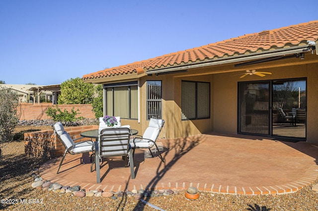 rear view of house with a patio and ceiling fan