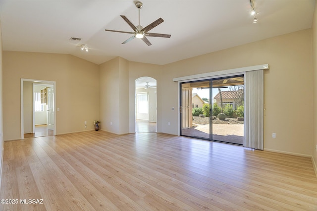 unfurnished living room featuring ceiling fan, vaulted ceiling, and light hardwood / wood-style flooring