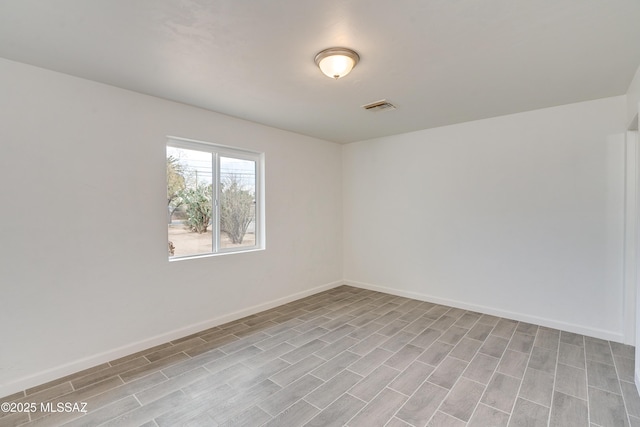 spare room featuring light hardwood / wood-style flooring