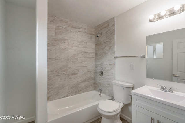 full bathroom with vanity, toilet, and tiled shower / bath