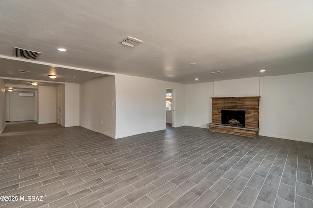 unfurnished living room featuring a fireplace and light wood-type flooring