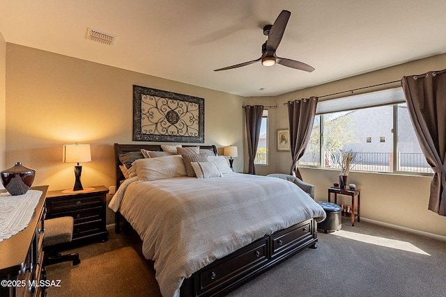 bedroom featuring dark carpet and ceiling fan