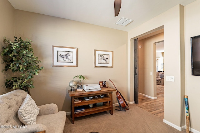 living area with light colored carpet