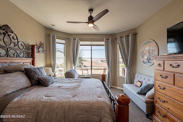 bedroom with ceiling fan and carpet floors