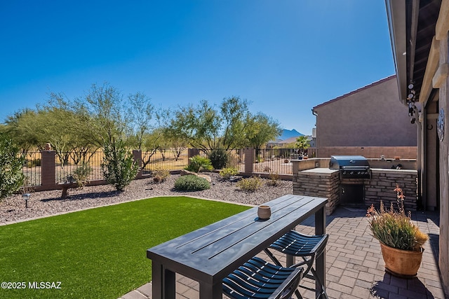 view of patio / terrace with area for grilling and exterior kitchen