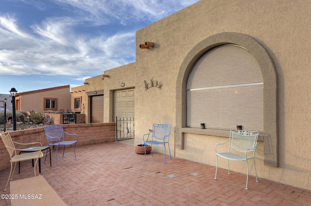 view of patio featuring a garage