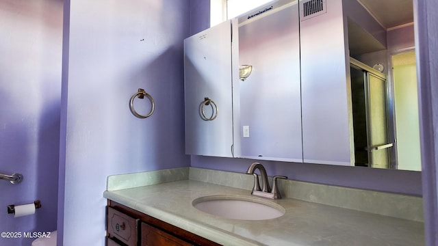 bathroom with vanity and walk in shower