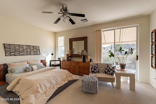 carpeted bedroom featuring access to exterior and ceiling fan