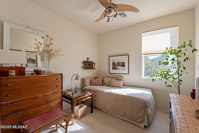 bedroom featuring ceiling fan and light colored carpet