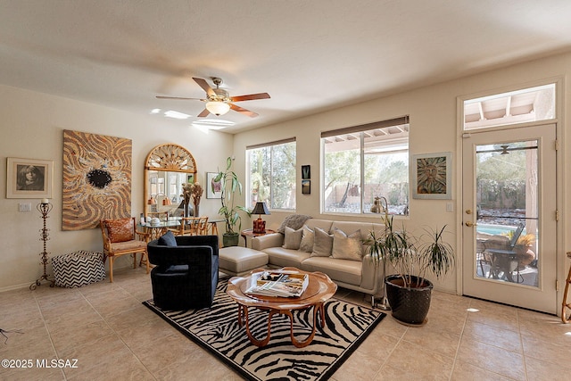 living room with light tile patterned flooring and ceiling fan