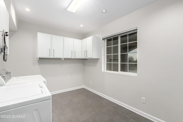 washroom with independent washer and dryer and cabinets