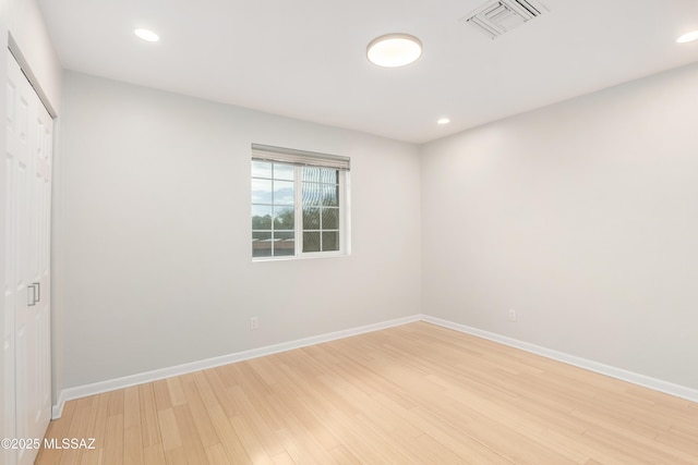 spare room with light wood-type flooring