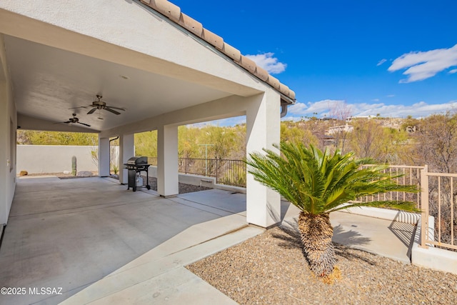 view of patio / terrace featuring a grill and ceiling fan