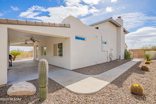 view of home's exterior with ceiling fan