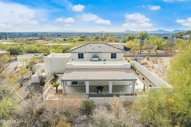 back of house featuring a mountain view