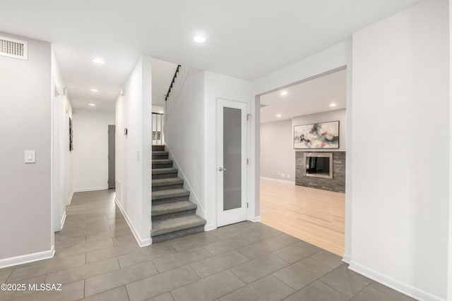 stairs with tile patterned floors