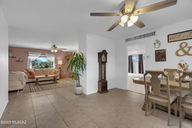 dining area with light tile patterned flooring and ceiling fan