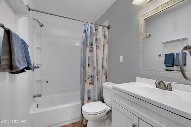 full bathroom featuring vanity, shower / bath combo with shower curtain, and toilet