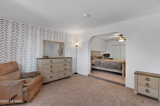 bedroom featuring light colored carpet