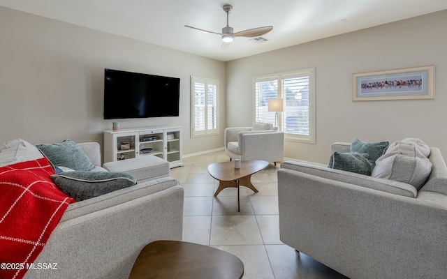 living room featuring ceiling fan and light tile patterned floors