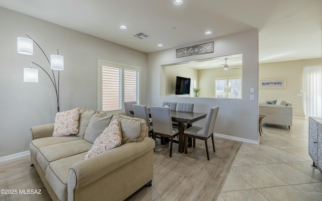 dining room featuring plenty of natural light, ceiling fan, and light hardwood / wood-style flooring