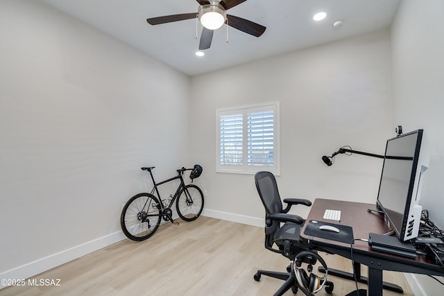 office featuring ceiling fan and light hardwood / wood-style flooring