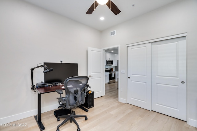 office area featuring ceiling fan and light hardwood / wood-style floors