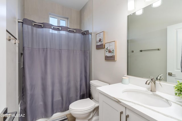 full bathroom featuring vanity, toilet, and shower / bath combo with shower curtain