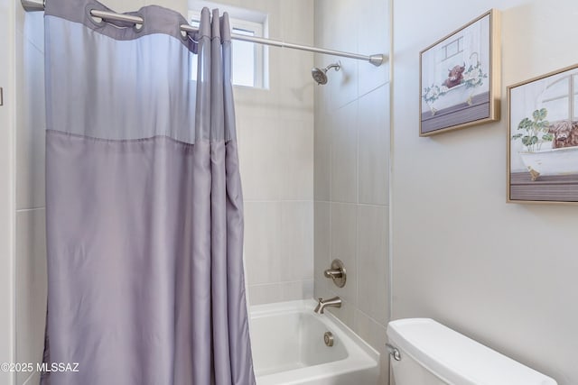 bathroom with shower / bath combination with curtain and toilet