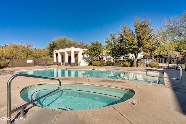 view of pool with a community hot tub and a patio