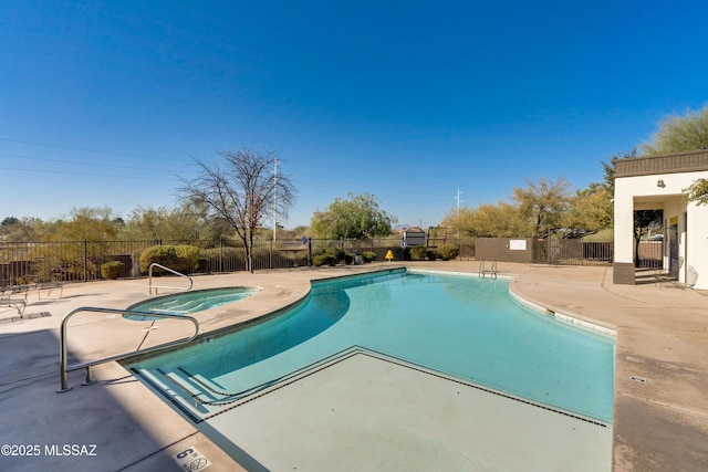 view of swimming pool with a patio