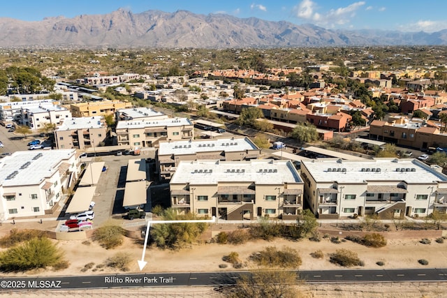 birds eye view of property featuring a mountain view