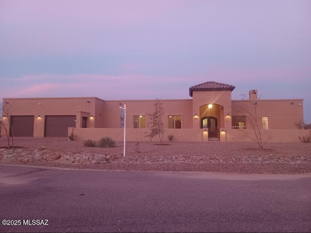 view of front of property with a garage