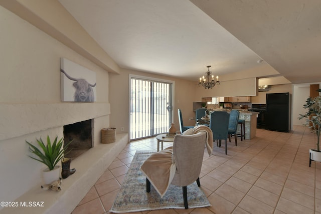 tiled living room with an inviting chandelier and a premium fireplace